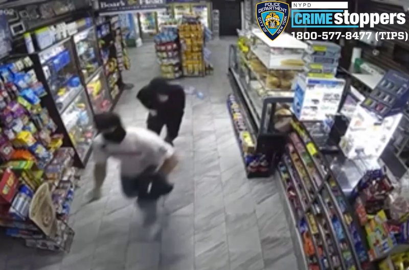 Surveillance video shows the two robbers fleeing the deli after the shooting