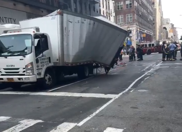The box truck that hit the MTA bus was damaged in the crash.