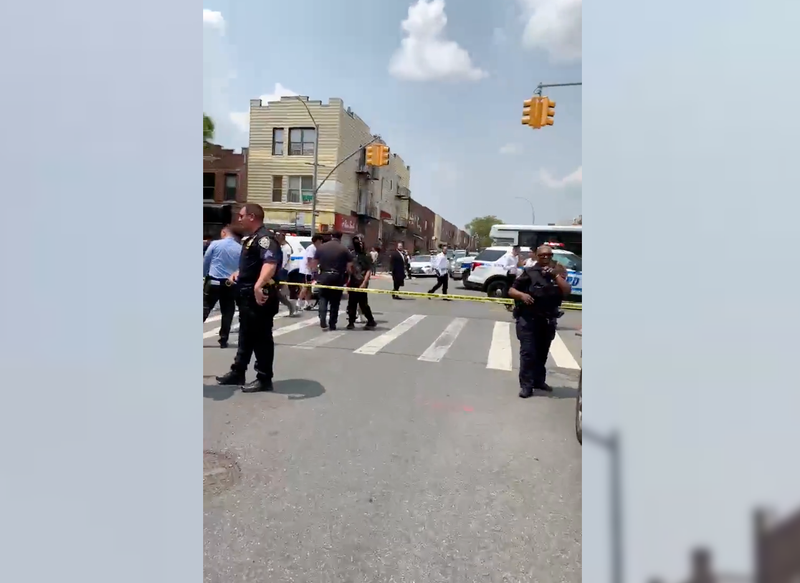 Teens were shot at as they stood outside a grocery store, police said