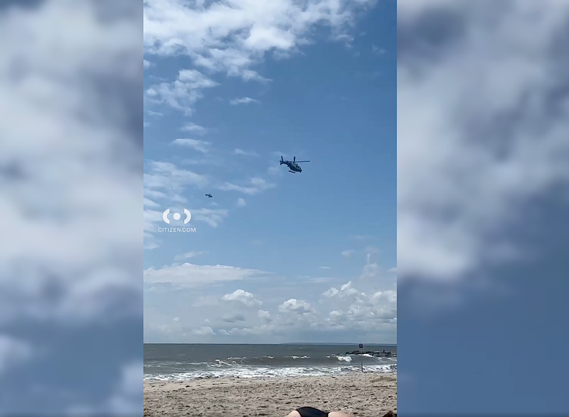 Helicopters patrolled beaches along the Rockaways on Tuesday