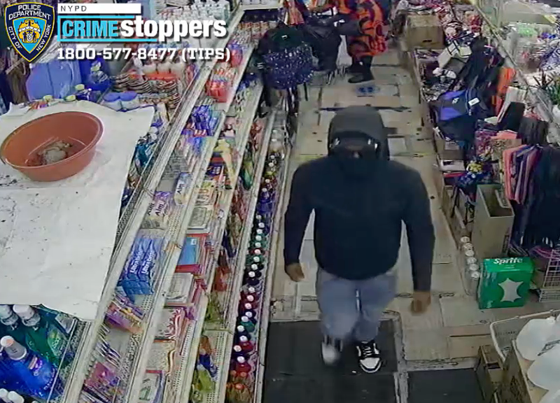The suspect wore sunglasses, a mask and a hood, video shows