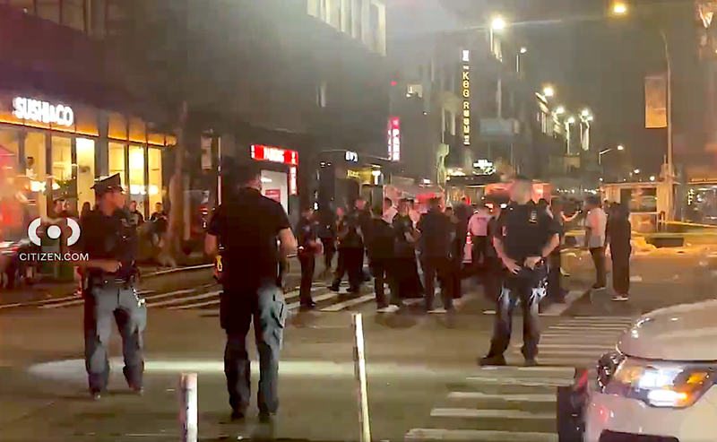 Police gather early Monday at the intersection where seven pedestrians were struck at West 36th Street and Sixth Avenue
