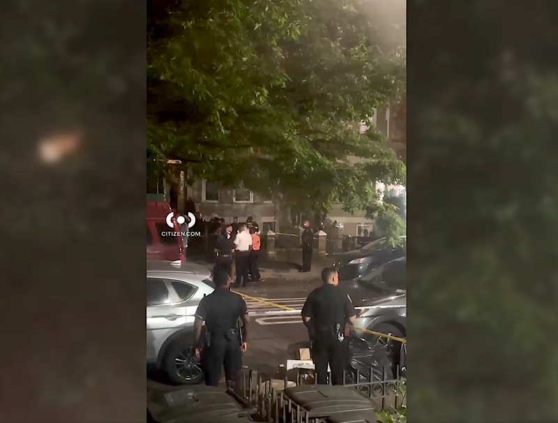 Police at the fatal shooting at 1337 Sterling Pl