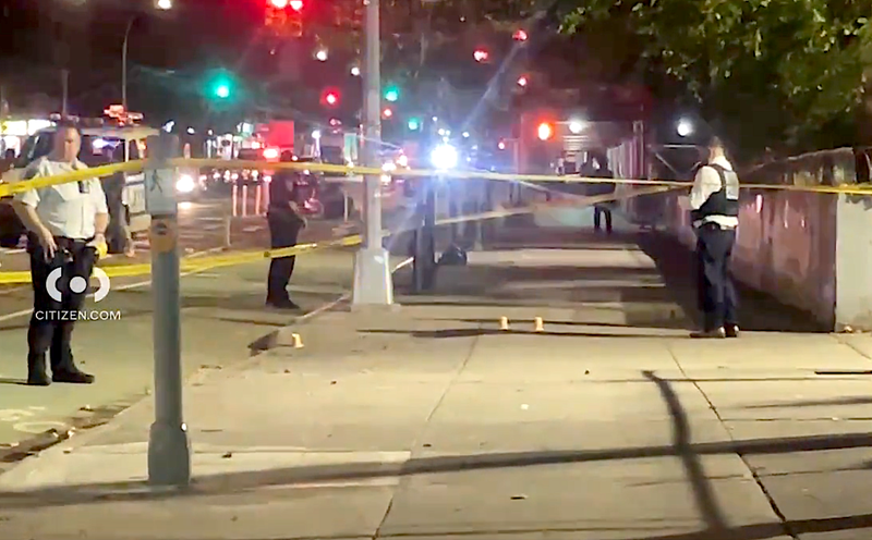 Police at the scene of a shooting on East 143rd Street in Mott Haven, where a 38-year-old woman was grazed by a bullet Wednesday evening