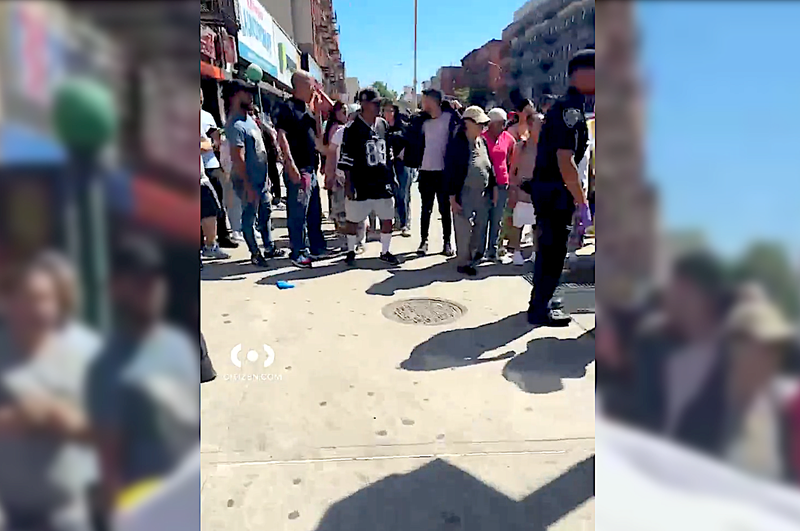 Residents gather at the scene of Thursday's shooting in Mott Haven that left a 71-year-old woman dead