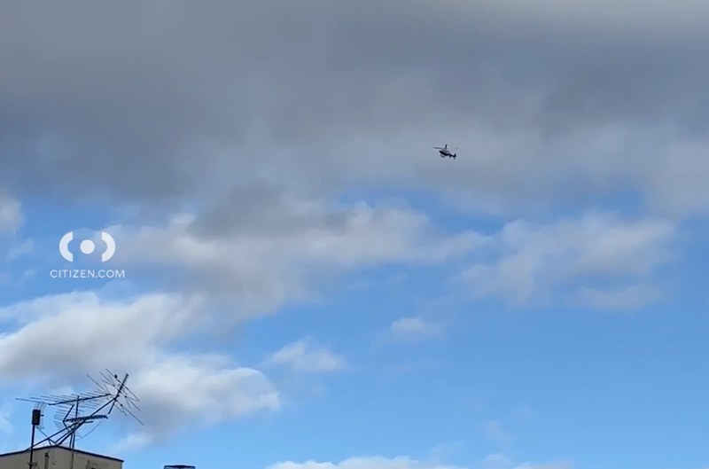 An NYPD helicopter hovered over the scene after the suspect fled