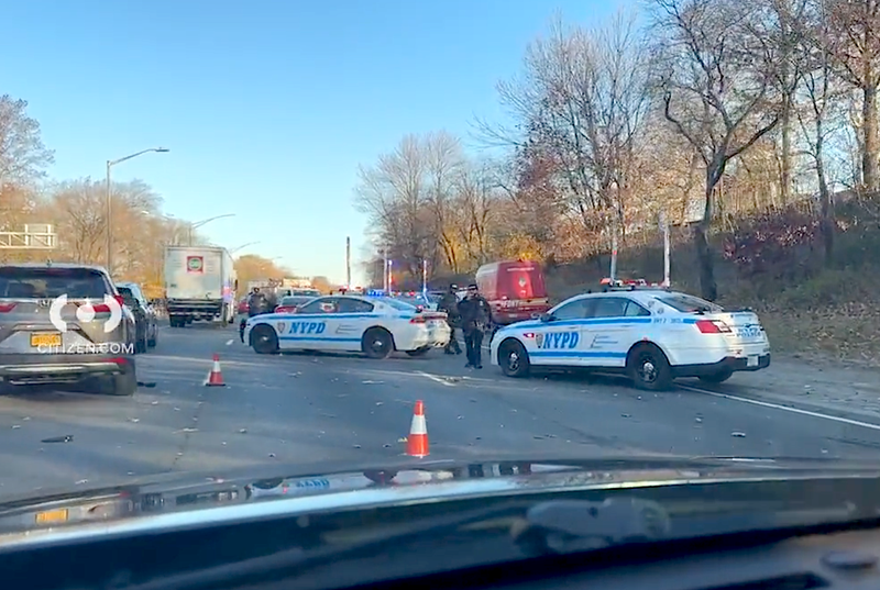 Police block off a crash scene on the Clearview Expressway on Tuesday morning