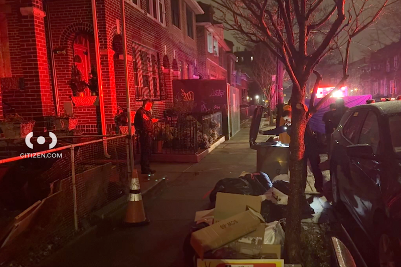 Police investigate at the scene of a mobbish home invasion robbery in Sunset Park on Sunday night