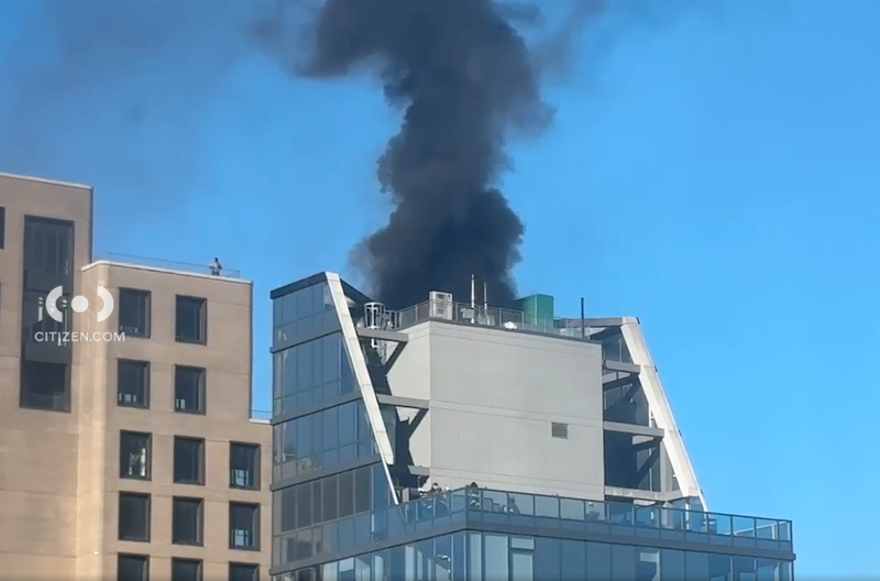 A plume of smoke poured out of the building on an otherwise crystal-clear Tuesday