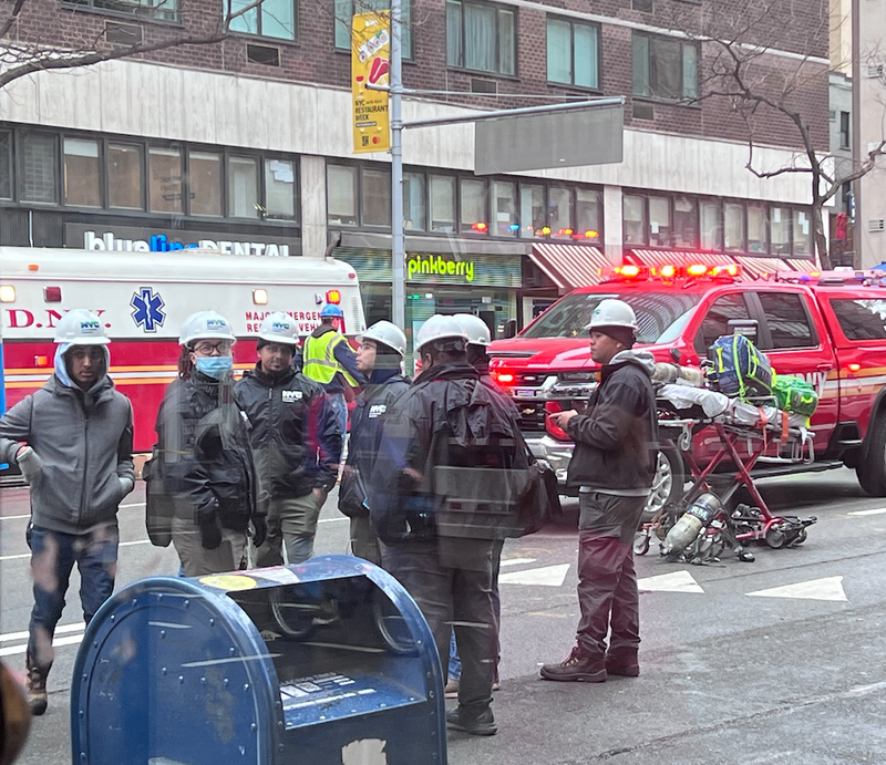 Emergency Management personnel, some masked, were spotted at the scene