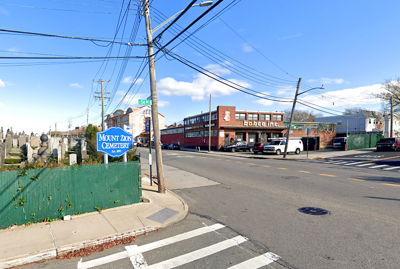 The bicyclist struck a box truck at 54th Avenue and Maurice Avenue in Maspeth shortly after 8 p.m. Thursday, police said
