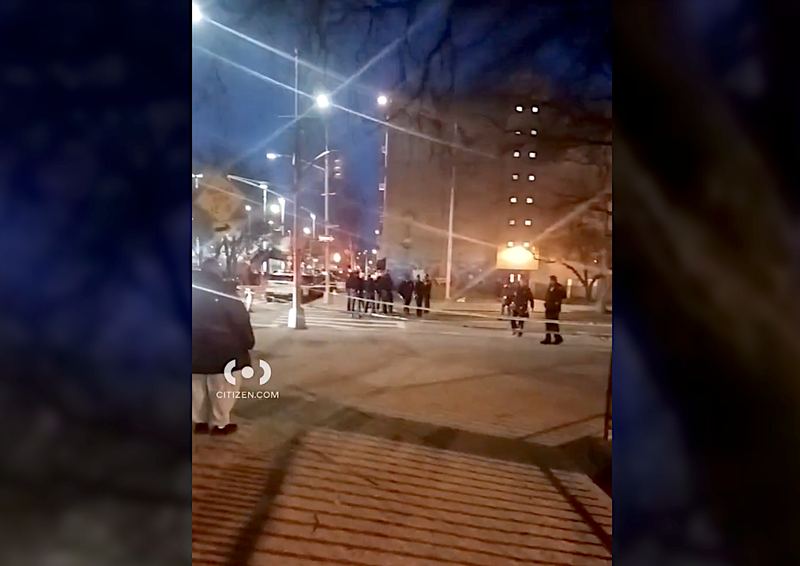 Police investigate at the scene of the shooting at East 128th Street and Lexington Avenue in East Harlem