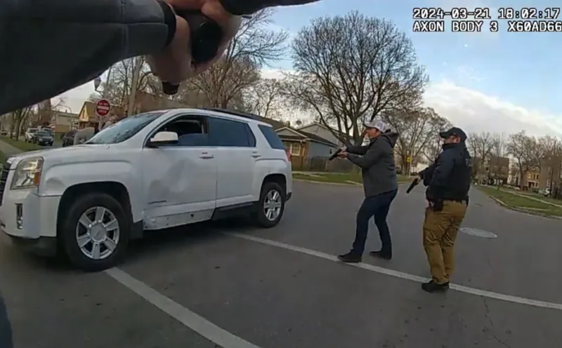 Body camera footage shows Chicago police officers surrounding Dexter Reed Jr.'s vehicle during what police have described as a traffic stop.