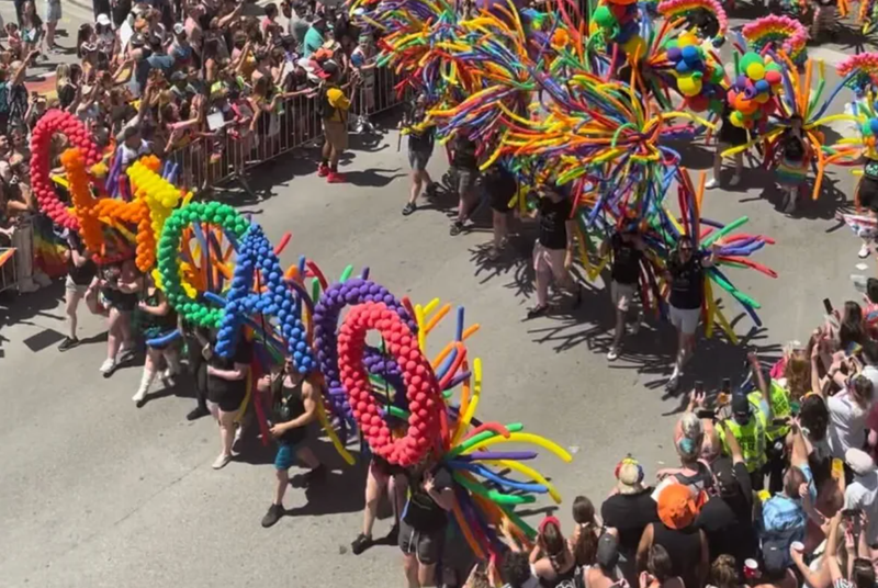 Participants in the Chicago Pride Parade march down Halsted Street.