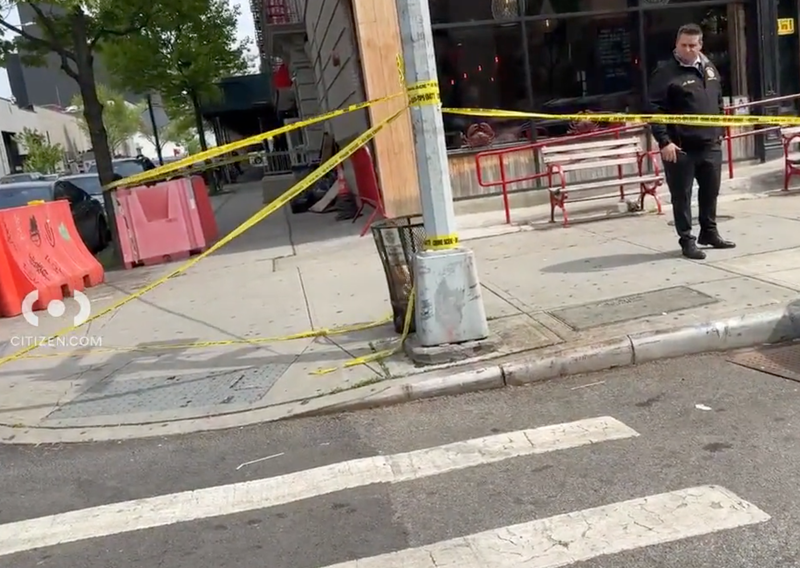 Police investigate at the scene of the shooting at West 154th Street and Frederick Douglass Boulevard