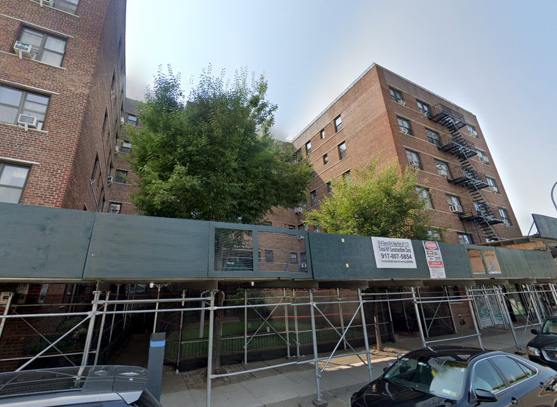 The body was found in bushes in front of this building at Queens Boulevard and 62nd Avenue in Rego Park