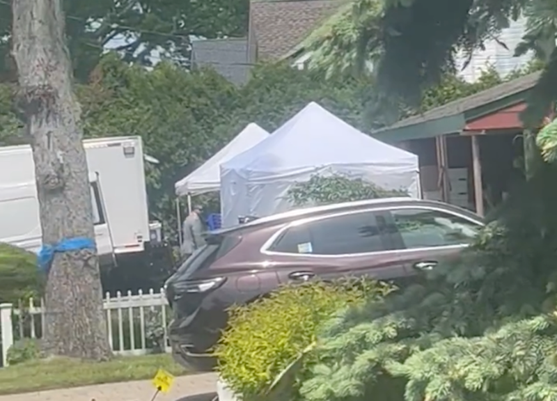 Law enforcement works at the home of Rex Heuermann on May 20, 2024