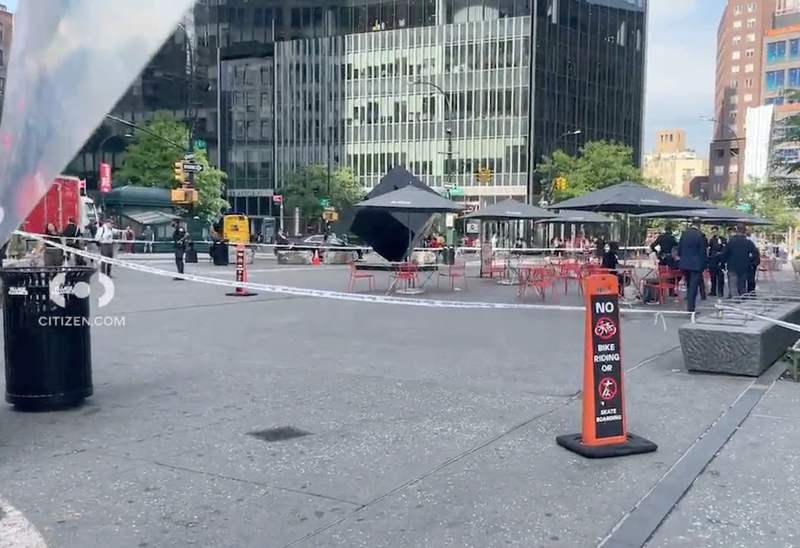Police tape is seen near the Astor Place Cube on Thursday evening