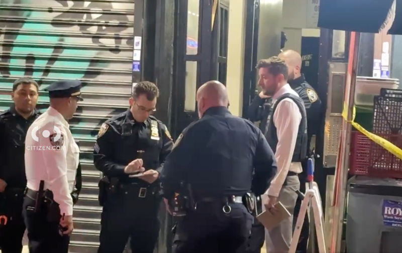 Police officers and detectives were seen outside the apartment building and in the lobby