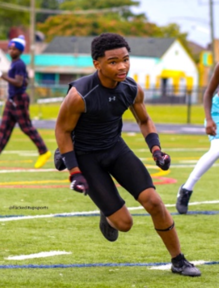 Young boy playing football