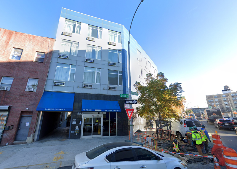The worker was stabbed to death at 1691 East New York Ave. in Brownsville, a former Days Inn that is now a homeless shelter