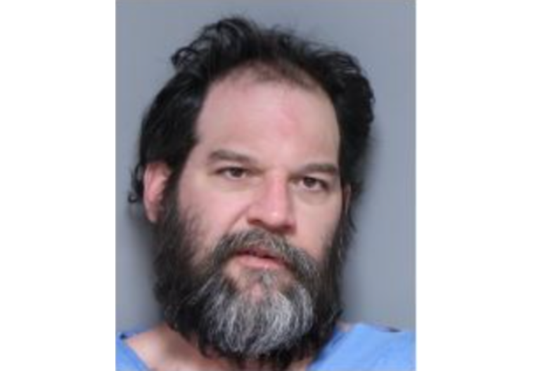 Mugshot of guy with greying beard