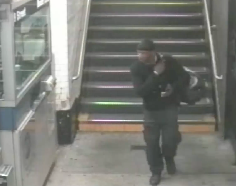 Surveillance footage shows the suspect carrying a duffle bag into a subway station after the burglary