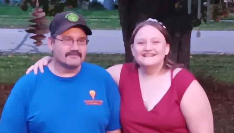 Man with smiling young girl