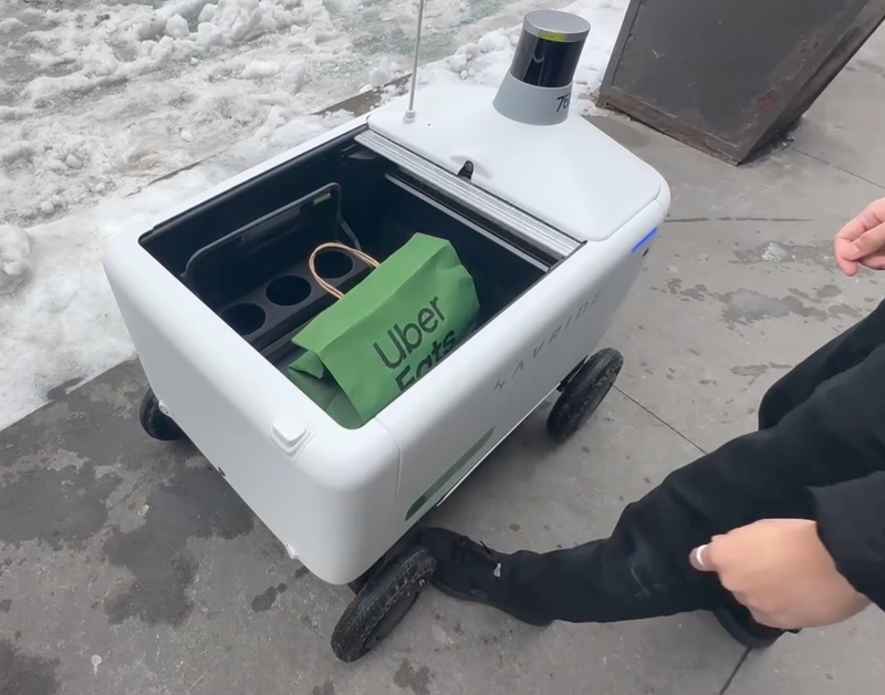 Customers can unlock the bot's hatch to retrieve their food