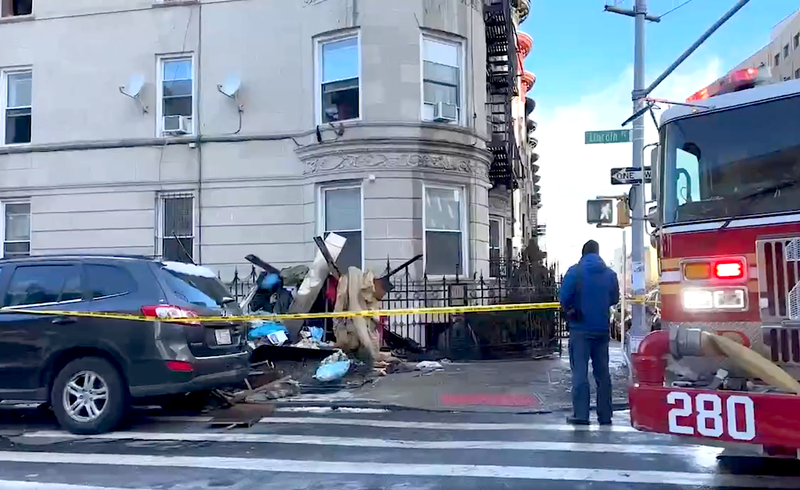 The victim was found dead in her apartment on the third floor of the four-story building