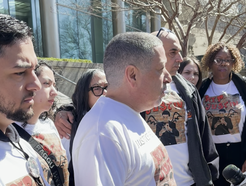 Family and friends of Justin Diaz—including his brother and father, left and center—were outside the courthouse after the hearing, wearing shirts that said, "Justice for Justin"