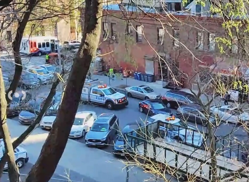 The victim was shot in the chest in broad daylight inside the lobby, police said