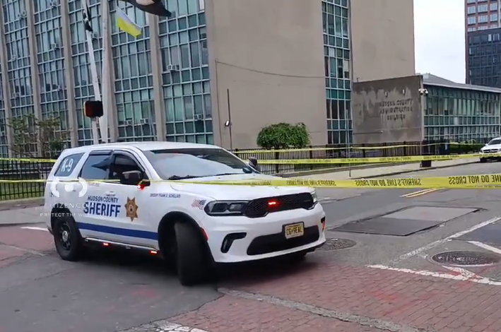 Officials are investigating the death of a Hudson County sheriff's officer who fell from a building in Jersey City Friday morning.