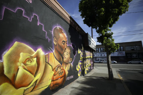 A mural depicting deceased NBA star Kobe Bryant and his daughter Gianna, painted by @sloe_motions, is displayed on a building on February 13, 2020 in Los Angeles, California.. 