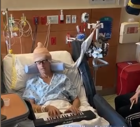 Mark Burnell undergoes neurosurgery while awake and playing music