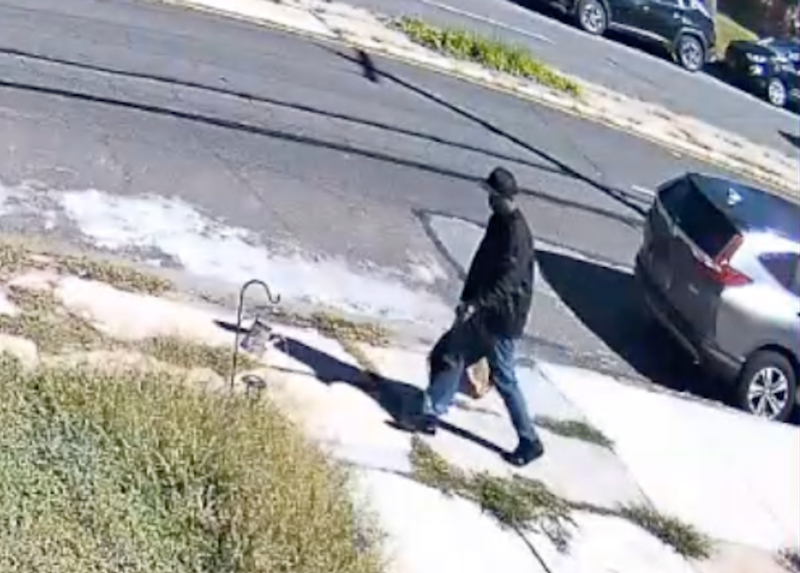 Surveillance video shows the suspect around the time of the home invasion and homicides