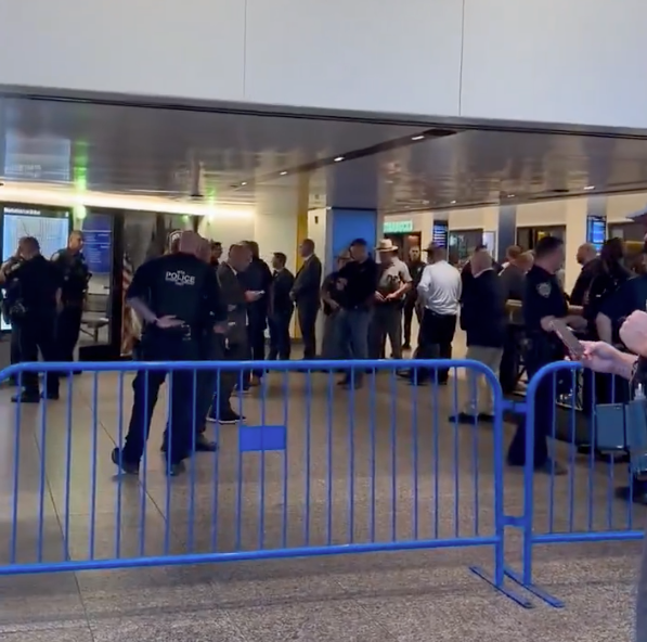 Police officers are seen at Penn Station after the shooting