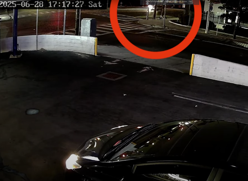 security footage of car and red circle around bike