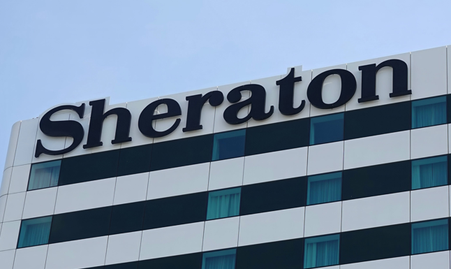 Detailed close-up of a Sheraton hotel building exterior