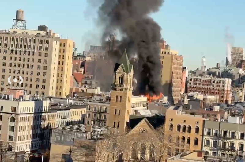 A column of smoke rose over the Upper West Side during the fire at West 107th Street and Amsterdam Avenue