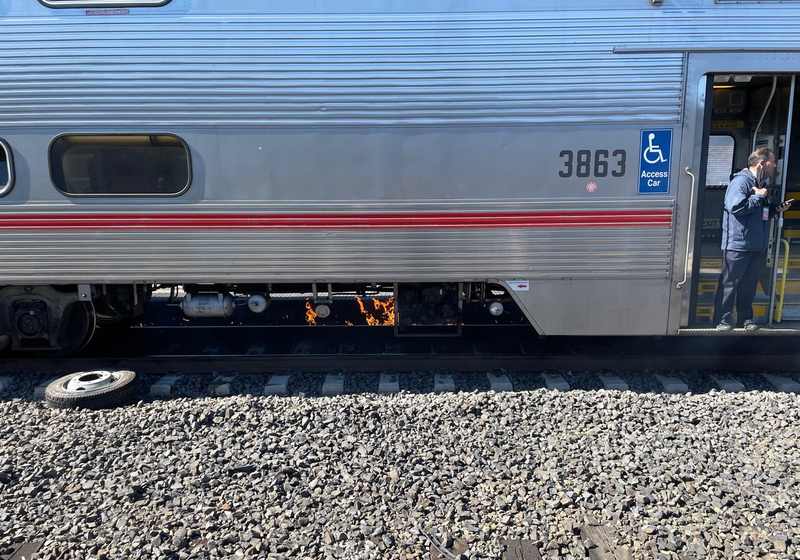 Fire seen underneath the Caltrain shortly after the crash.