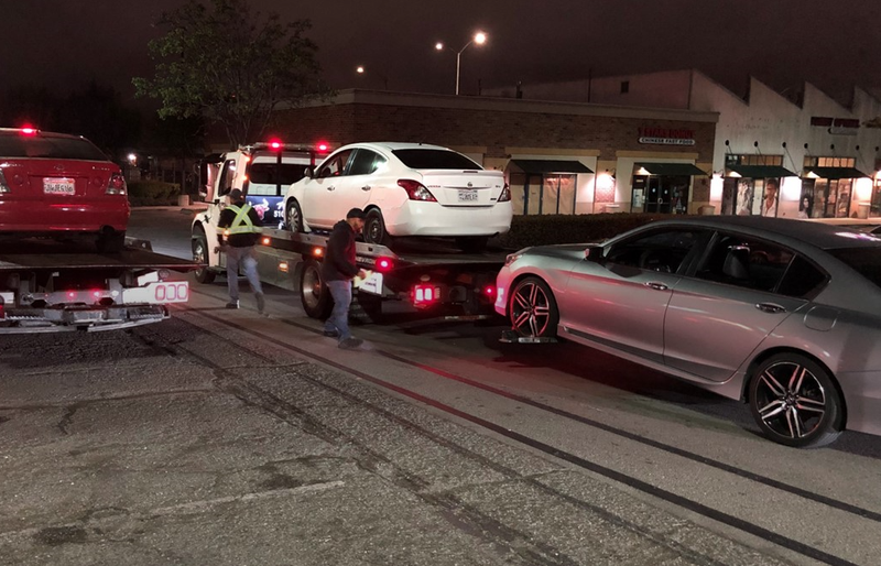 Three of 60 vehicles towed by Oakland police on Friday morning.