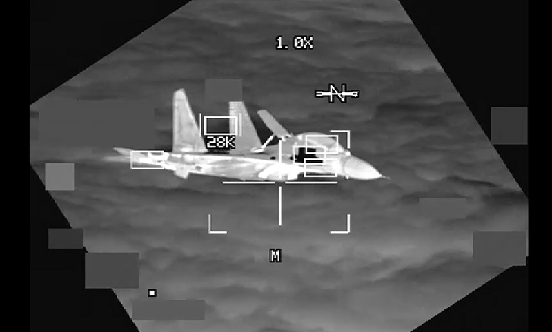 Screenshot of "Unprofessional Intercept of U.S. B-52 over South China Sea" footage.