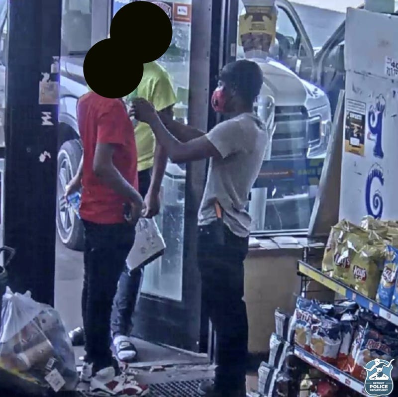 Suspect next to two victims with blurred out faces