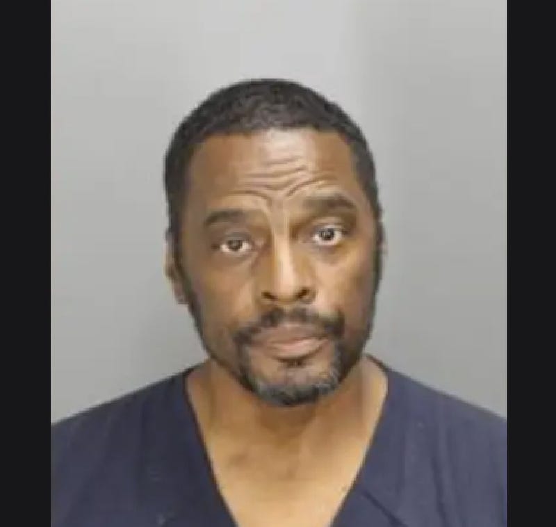 Man posing for mugshot 