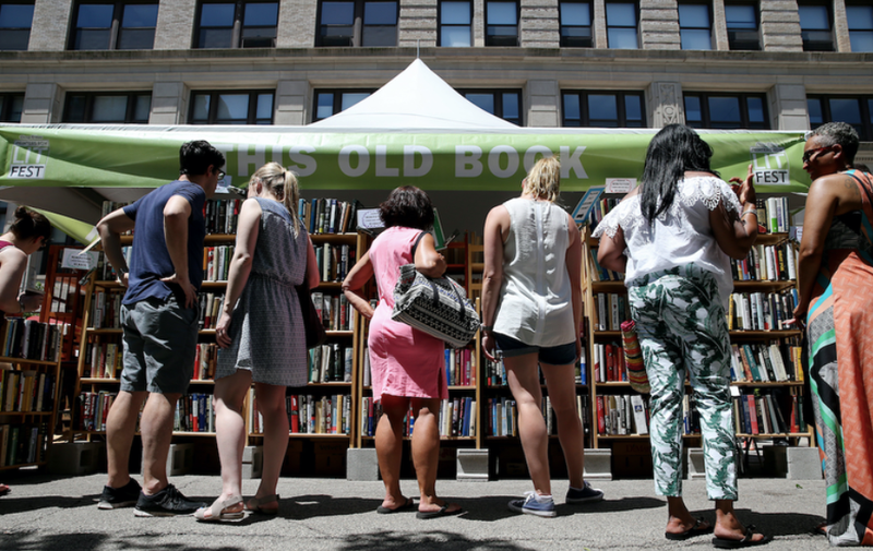 People shop for books at the Printers Row Lit Fest Saturday, June 10, 2017, in Chicago, Ill.