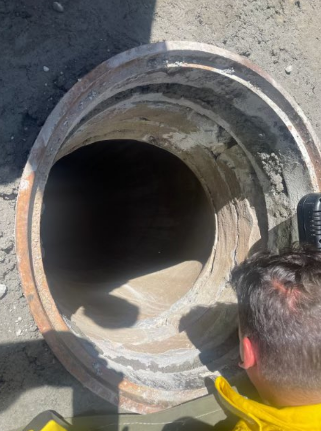The manhole is estimated at 20 feet deep.