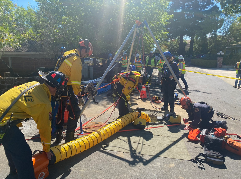 Crews set up ropes to rescue the unidentified man.