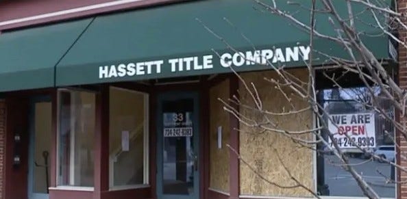 Hassett Title Company with boarded up windows