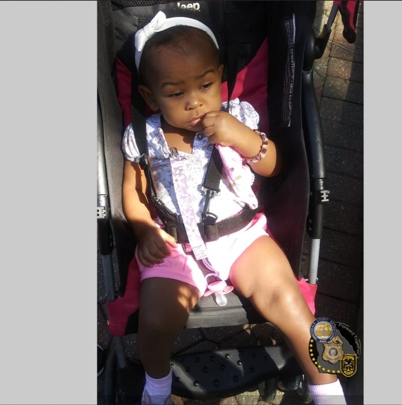 When last seen 1 year old Royalton Grisby was wearing a pink jacket, purple shirt, purple pants, and pink and white socks